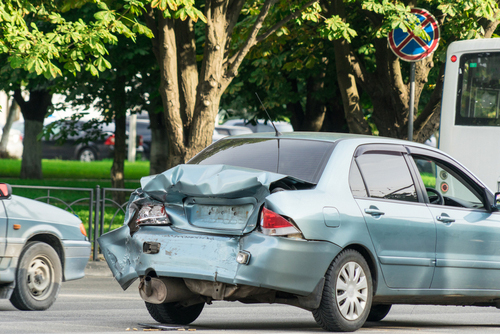 A car that has been damaged in a rear-end collision.